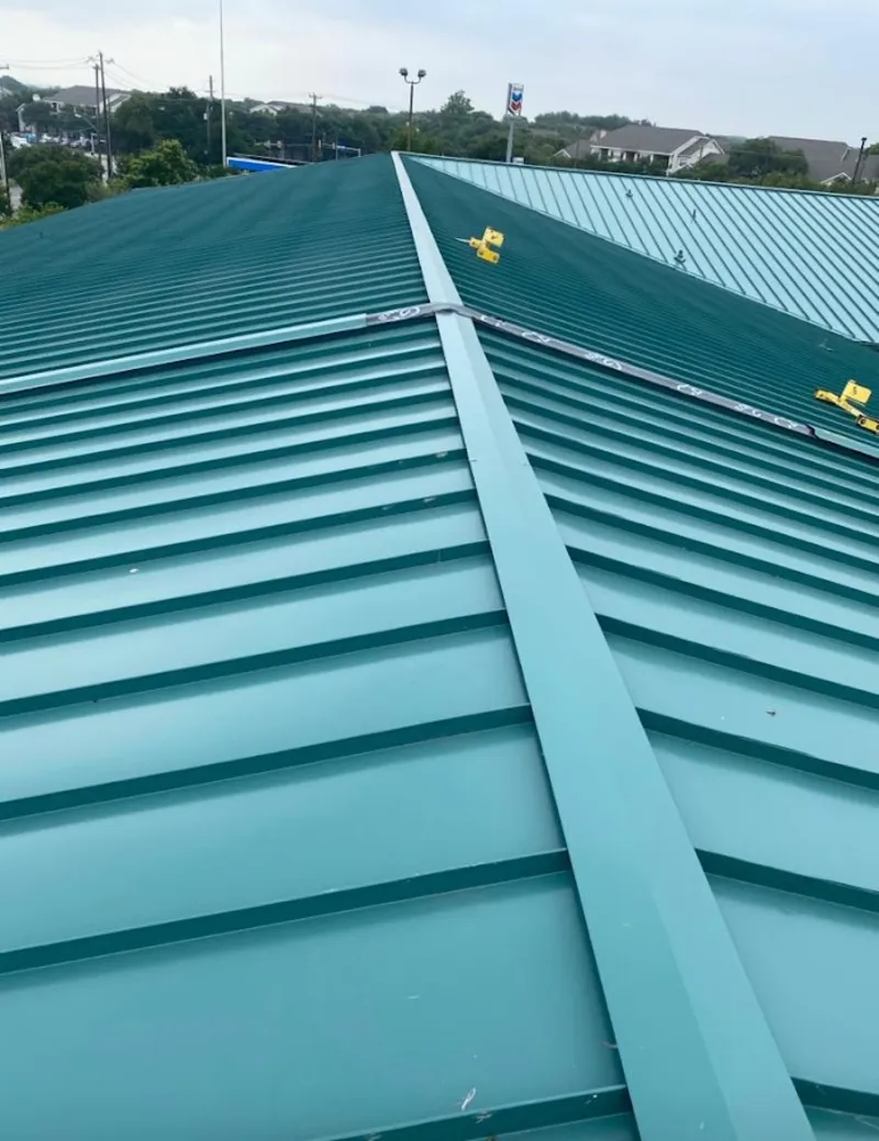 Green commercial metal roof ridge and valley for Metal Roof Repair in Middlesex